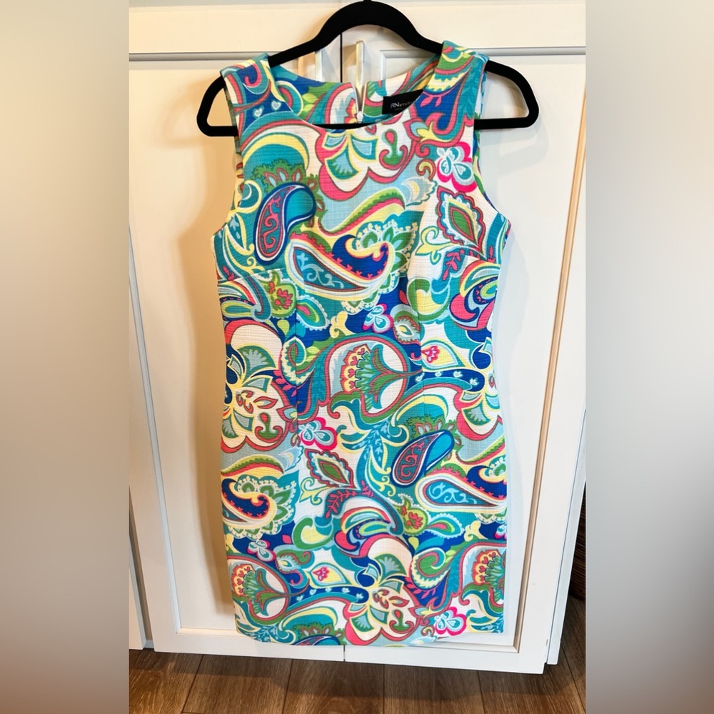 Sleeveless multi color stunning dress. Lined, easy care.